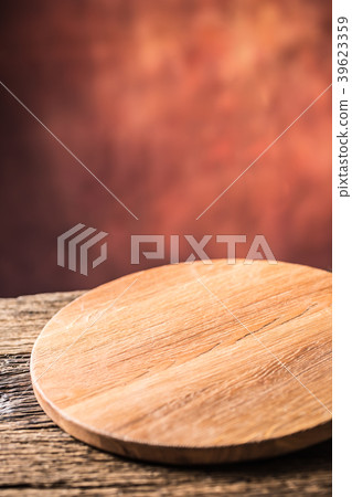 Empty pizza round board  on old wooden table. 39623359