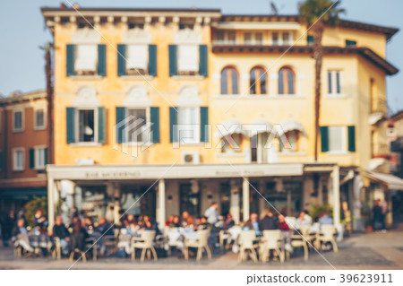 Blurred people in old city street cafe. Blurred people in old city street cafe. 39623911