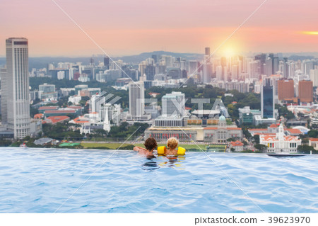 Kids swim in Singapore roof top swimming pool Kids swim in Singapore roof top swimming pool 39623970