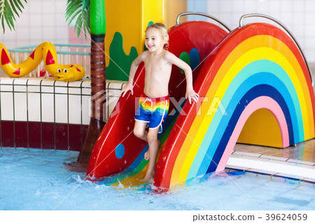 Child on swimming pool slide. Kids swim. Water fun Child on swimming pool slide. Kids swim. Water fun 39624059
