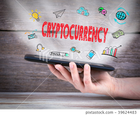 cryptocurrency. Tablet computer in the hand. Old wooden background cryptocurrency. Tablet computer in the hand. Old wooden background 39624483
