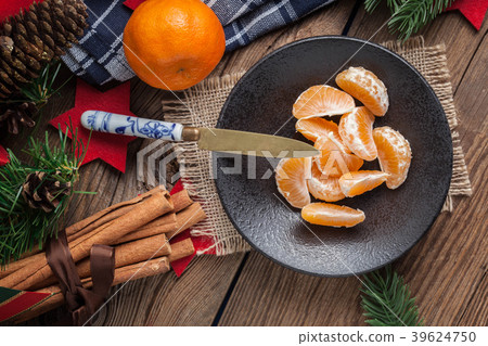 Peeled tangerine on the wooden table. Peeled tangerine on the wooden table. 39624750