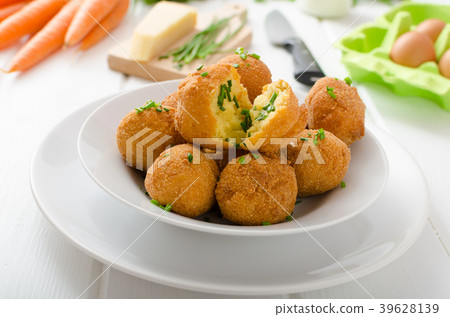 Homemade potato croquettes with parmesan and chives Homemade potato croquettes with parmesan and chives 39628139
