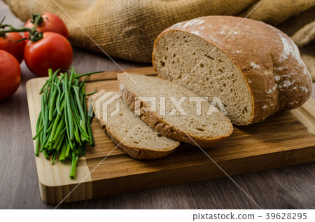 Healthy breakfast - homemade beer bread with cheese, tomatoes and chives Healthy breakfast - homemade beer bread with cheese, tomatoes and chives 39628295