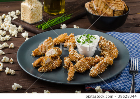 Chicken strips in popcorn breadcrumbs 39628344