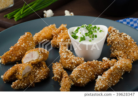 Chicken strips in popcorn breadcrumbs 39628347