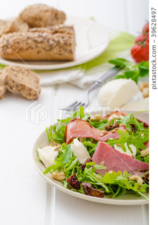 Arugula salad with meat and mozzarella 39628497