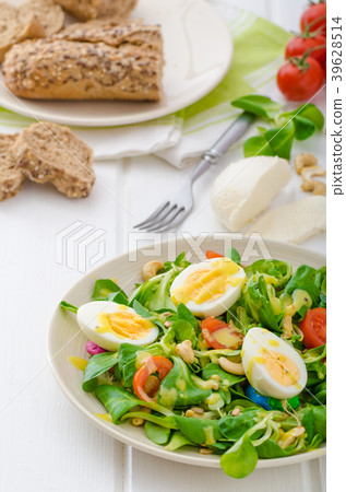 Lamb's lettuce salad with eggs and nuts 39628514