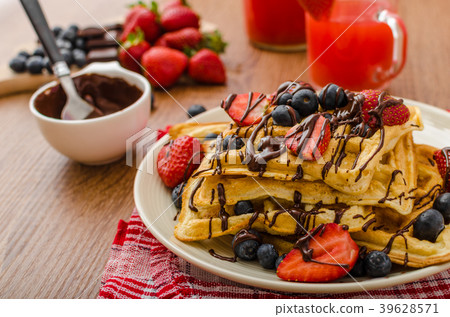 Belgian waffles with blueberries, strawberries 39628571