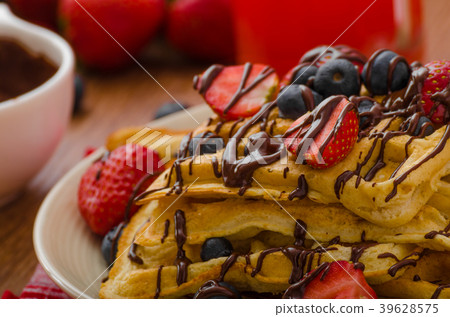 Belgian waffles with blueberries, strawberries 39628575