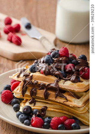 Homemade belgian waffles with fruit and chocolate Homemade belgian waffles with fruit and chocolate 39629210