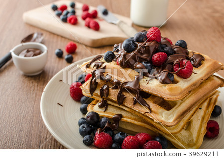 Homemade belgian waffles with fruit and chocolate Homemade belgian waffles with fruit and chocolate 39629211