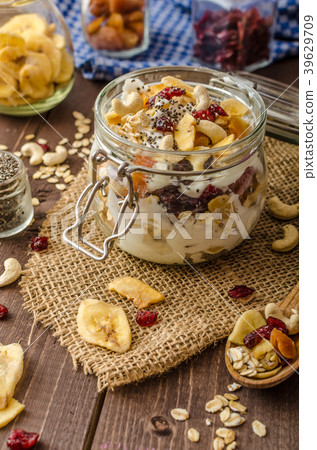 Homemade yogurt with granola, dried fruit and nuts bio Homemade yogurt with granola, dried fruit and nuts bio 39629709
