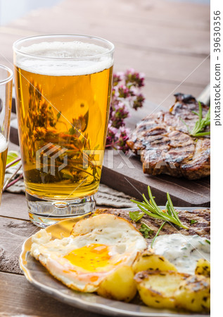 Grilled pork meat with beer 39630356