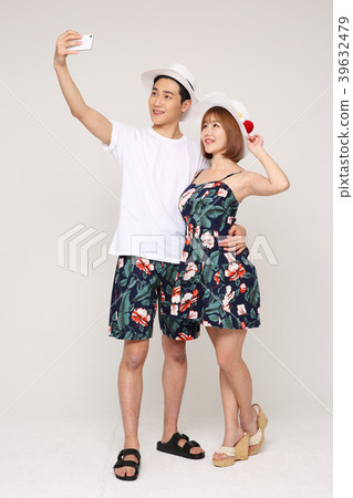 Happy young traveler couple concept photo. set out on a trip to honeymoon, camping and summer vacation concept isolated on white background. 472 Happy young traveler couple concept photo. set out on a trip to honeymoon, camping and summer vacation concept isolated on white background. 472 39632479