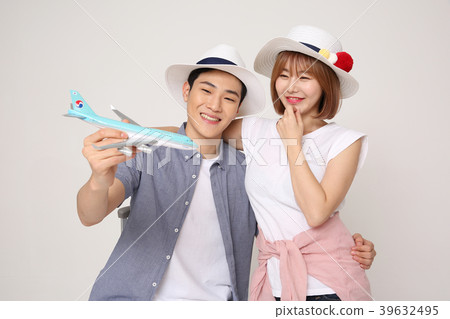 Happy young traveler couple concept photo. set out on a trip to honeymoon, camping and summer vacation concept isolated on white background. 433 Happy young traveler couple concept photo. set out on a trip to honeymoon, camping and summer vacation concept isolated on white background. 433 39632495