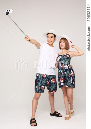 Happy young traveler couple concept photo. set out on a trip to honeymoon, camping and summer vacation concept isolated on white background. 479 Happy young traveler couple concept photo. set out on a trip to honeymoon, camping and summer vacation concept isolated on white background. 479 39632514