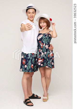 Happy young traveler couple concept photo. set out on a trip to honeymoon, camping and summer vacation concept isolated on white background. 474 Happy young traveler couple concept photo. set out on a trip to honeymoon, camping and summer vacation concept isolated on white background. 474 39632523
