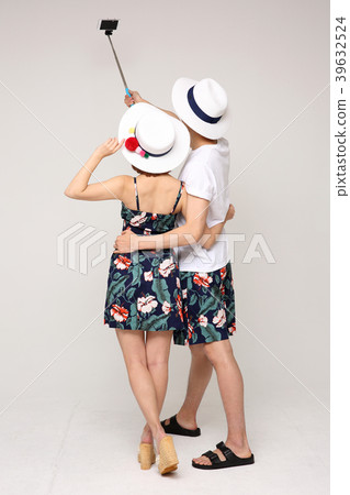 Happy young traveler couple concept photo. set out on a trip to honeymoon, camping and summer vacation concept isolated on white background. 476 Happy young traveler couple concept photo. set out on a trip to honeymoon, camping and summer vacation concept isolated on white background. 476 39632524