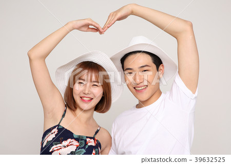 Happy young traveler couple concept photo. set out on a trip to honeymoon, camping and summer vacation concept isolated on white background. 469 Happy young traveler couple concept photo. set out on a trip to honeymoon, camping and summer vacation concept isolated on white background. 469 39632525