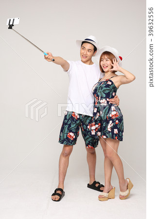 Happy young traveler couple concept photo. set out on a trip to honeymoon, camping and summer vacation concept isolated on white background. 478 Happy young traveler couple concept photo. set out on a trip to honeymoon, camping and summer vacation concept isolated on white background. 478 39632556