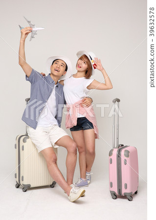 Happy young traveler couple concept photo. set out on a trip to honeymoon, camping and summer vacation concept isolated on white background. 431 Happy young traveler couple concept photo. set out on a trip to honeymoon, camping and summer vacation concept isolated on white background. 431 39632578
