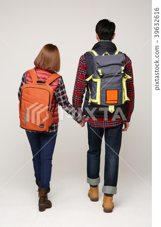 Happy young traveler couple concept photo. set out on a trip to honeymoon, camping and summer vacation concept isolated on white background. 372 Happy young traveler couple concept photo. set out on a trip to honeymoon, camping and summer vacation concept isolated on white background. 372 39632616
