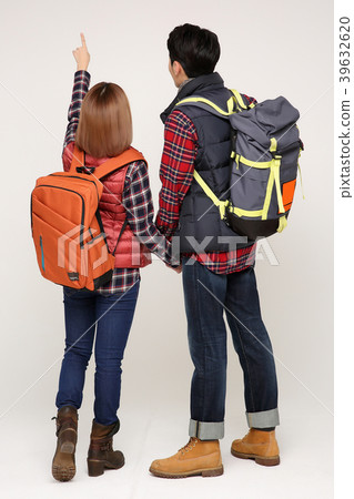 Happy young traveler couple concept photo. set out on a trip to honeymoon, camping and summer vacation concept isolated on white background. 374 Happy young traveler couple concept photo. set out on a trip to honeymoon, camping and summer vacation concept isolated on white background. 374 39632620