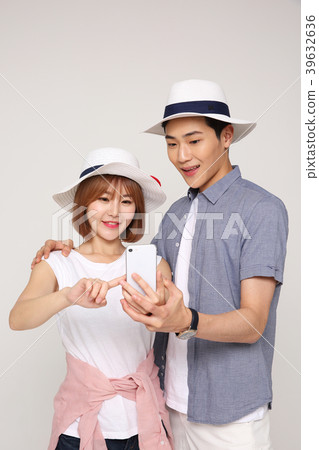 Happy young traveler couple concept photo. set out on a trip to honeymoon, camping and summer vacation concept isolated on white background. 422 Happy young traveler couple concept photo. set out on a trip to honeymoon, camping and summer vacation concept isolated on white background. 422 39632636