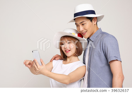 Happy young traveler couple concept photo. set out on a trip to honeymoon, camping and summer vacation concept isolated on white background. 423 39632637