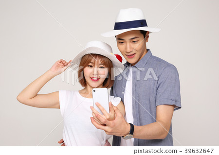 Happy young traveler couple concept photo. set out on a trip to honeymoon, camping and summer vacation concept isolated on white background. 420 Happy young traveler couple concept photo. set out on a trip to honeymoon, camping and summer vacation concept isolated on white background. 420 39632647