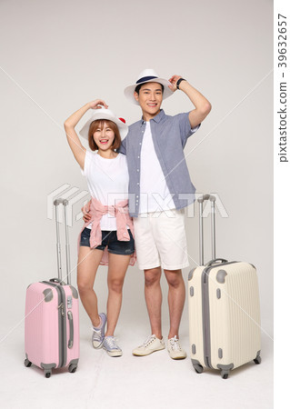 Happy young traveler couple concept photo. set out on a trip to honeymoon, camping and summer vacation concept isolated on white background. 416 Happy young traveler couple concept photo. set out on a trip to honeymoon, camping and summer vacation concept isolated on white background. 416 39632657