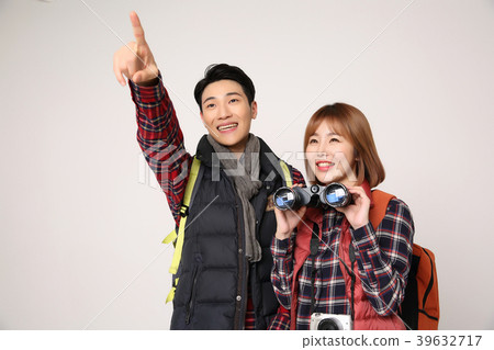Happy young traveler couple concept photo. set out on a trip to honeymoon, camping and summer vacation concept isolated on white background. 399 Happy young traveler couple concept photo. set out on a trip to honeymoon, camping and summer vacation concept isolated on white background. 399 39632717
