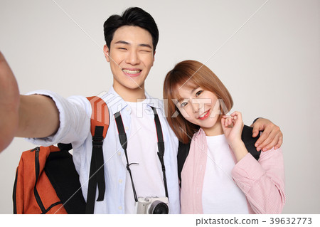 Happy young traveler couple concept photo. set out on a trip to honeymoon, camping and summer vacation concept isolated on white background. 193 Happy young traveler couple concept photo. set out on a trip to honeymoon, camping and summer vacation concept isolated on white background. 193 39632773