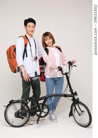 Happy young traveler couple concept photo. set out on a trip to honeymoon, camping and summer vacation concept isolated on white background. 225 Happy young traveler couple concept photo. set out on a trip to honeymoon, camping and summer vacation concept isolated on white background. 225 39632802