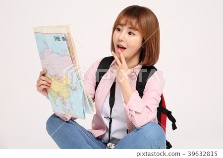 Young traveler woman with a backpack concept isolated on White photo. 127 Young traveler woman with a backpack concept isolated on White photo. 127 39632815