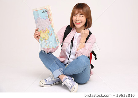 Young traveler woman with a backpack concept isolated on White photo. 130 Young traveler woman with a backpack concept isolated on White photo. 130 39632816