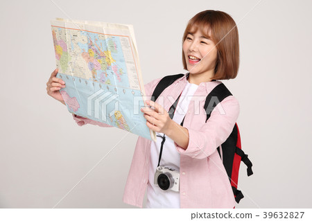 Young traveler woman with a backpack concept isolated on White photo. 117 Young traveler woman with a backpack concept isolated on White photo. 117 39632827