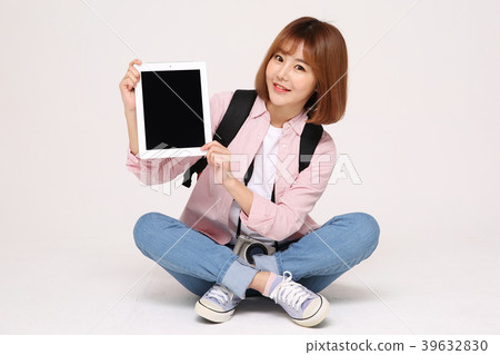 Young traveler woman with a backpack concept isolated on White photo. 112 Young traveler woman with a backpack concept isolated on White photo. 112 39632830