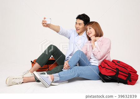 Happy young traveler couple concept photo. set out on a trip to honeymoon, camping and summer vacation concept isolated on white background. 204 Happy young traveler couple concept photo. set out on a trip to honeymoon, camping and summer vacation concept isolated on white background. 204 39632839