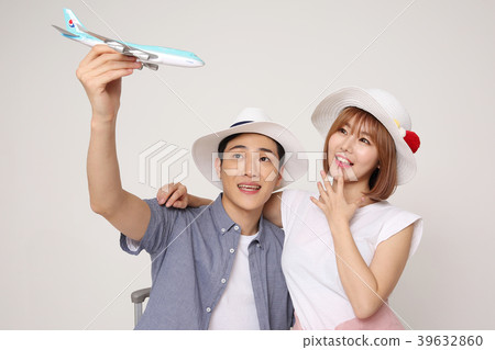 Happy young traveler couple concept photo. set out on a trip to honeymoon, camping and summer vacation concept isolated on white background. 434 Happy young traveler couple concept photo. set out on a trip to honeymoon, camping and summer vacation concept isolated on white background. 434 39632860