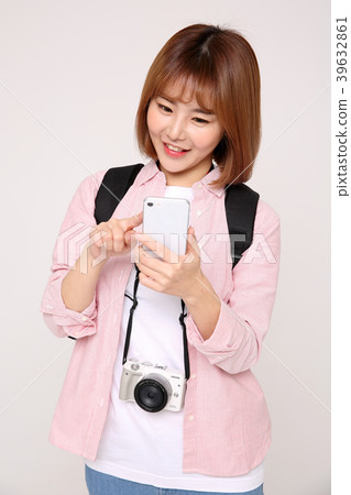 Young traveler woman with a backpack concept isolated on White photo. 098 Young traveler woman with a backpack concept isolated on White photo. 098 39632861