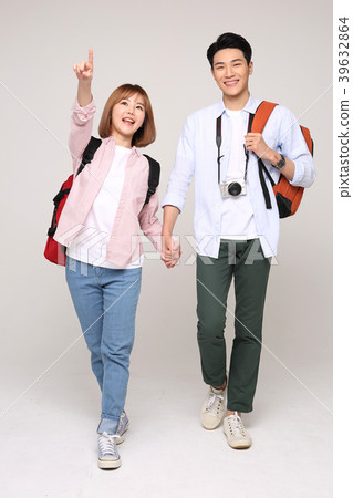 Happy young traveler couple concept photo. set out on a trip to honeymoon, camping and summer vacation concept isolated on white background. 150 Happy young traveler couple concept photo. set out on a trip to honeymoon, camping and summer vacation concept isolated on white background. 150 39632864