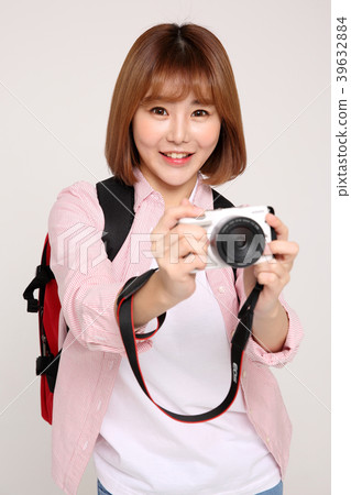 Young traveler woman with a backpack concept isolated on White photo. 074 Young traveler woman with a backpack concept isolated on White photo. 074 39632884