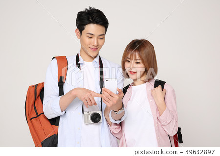 Happy young traveler couple concept photo. set out on a trip to honeymoon, camping and summer vacation concept isolated on white background. 213 Happy young traveler couple concept photo. set out on a trip to honeymoon, camping and summer vacation concept isolated on white background. 213 39632897