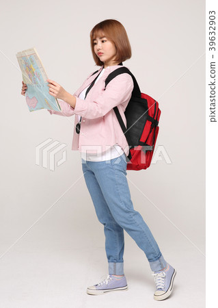 Young traveler woman with a backpack concept isolated on White photo. 122 Young traveler woman with a backpack concept isolated on White photo. 122 39632903