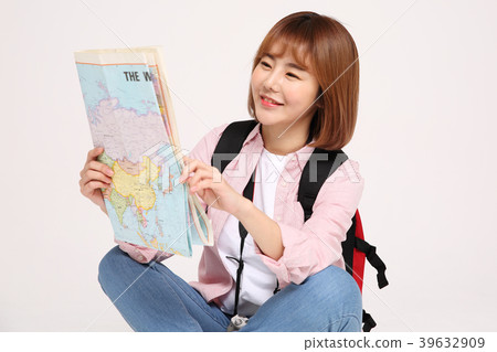 Young traveler woman with a backpack concept isolated on White photo. 128 Young traveler woman with a backpack concept isolated on White photo. 128 39632909