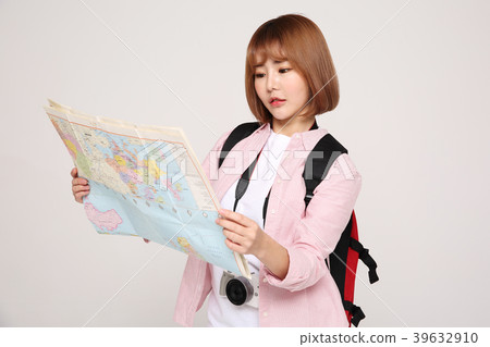 Young traveler woman with a backpack concept isolated on White photo. 118 Young traveler woman with a backpack concept isolated on White photo. 118 39632910