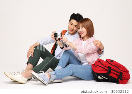 Happy young traveler couple concept photo. set out on a trip to honeymoon, camping and summer vacation concept isolated on white background. 201 Happy young traveler couple concept photo. set out on a trip to honeymoon, camping and summer vacation concept isolated on white background. 201 39632912