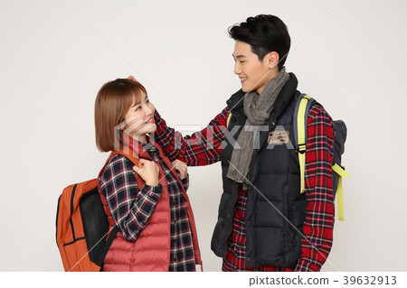 Happy young traveler couple concept photo. set out on a trip to honeymoon, camping and summer vacation concept isolated on white background. 370 Happy young traveler couple concept photo. set out on a trip to honeymoon, camping and summer vacation concept isolated on white background. 370 39632913